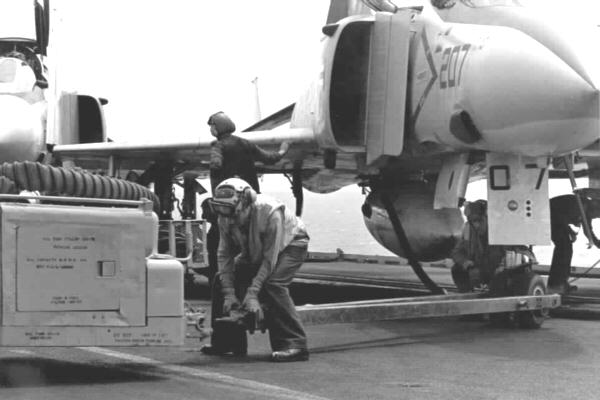 Atlantic Ocean - Oct.74 *
V1 crewman prepares to spot F-4J Phantom (VF-33)